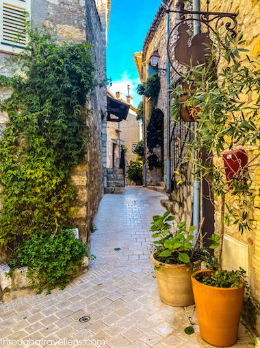 Picturesque street in Mougins with stone facades, flowers, and charming details – mougins things to do.