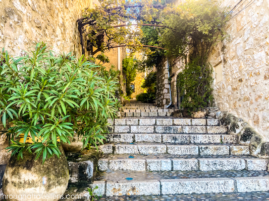 A cozy corner in St Paul de Vence, featuring rustic stone walls and charming details.