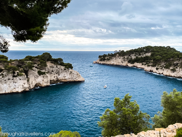 The stunning Calanques of Cassis, featuring turquoise waters and towering limestone cliffs.